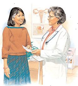 Fornitore di assistenza sanitaria consegna prescrizione alla donna.